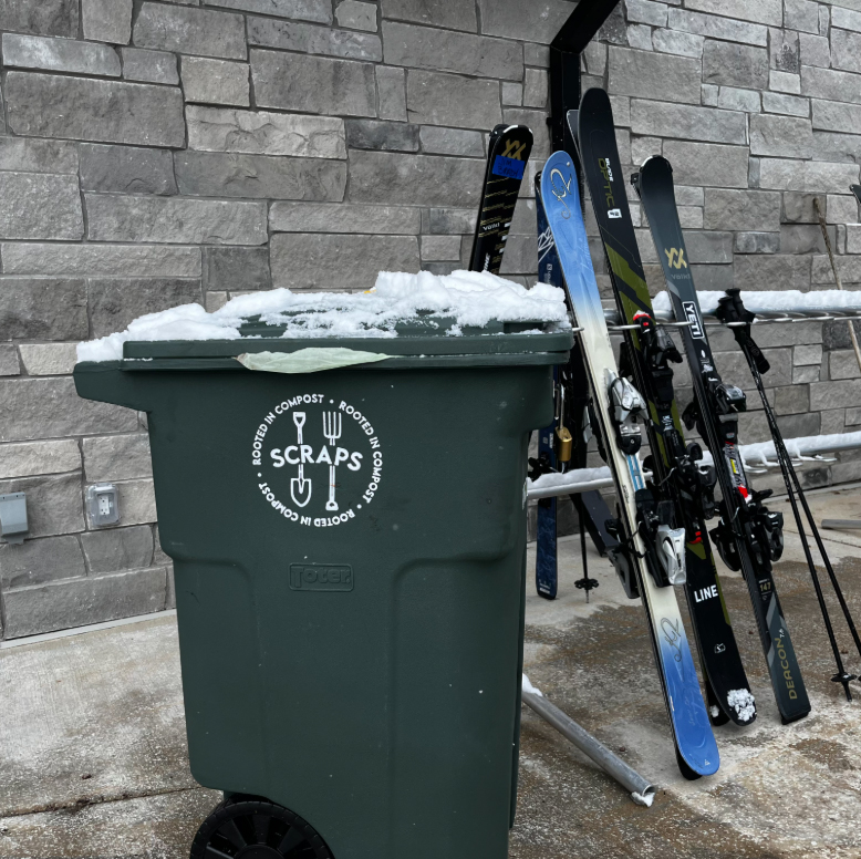 Sraps collection tote in front of ski rack