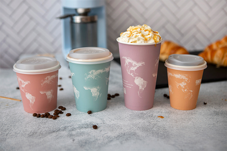 Four new World Art™ Hot cups lined up on a counter